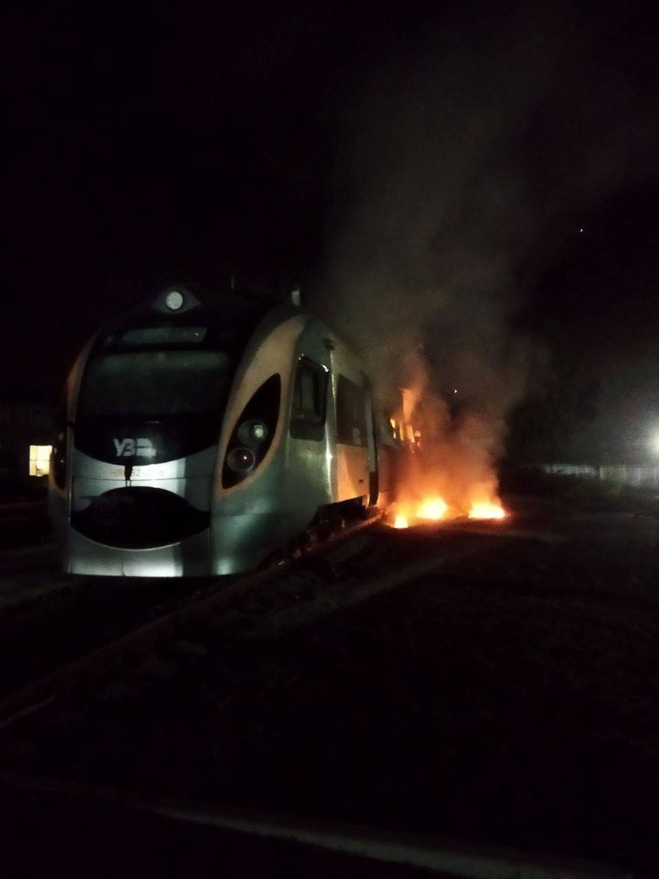 HRCS2 trainset on fire at the trackside at night — Ukraine, February 2022