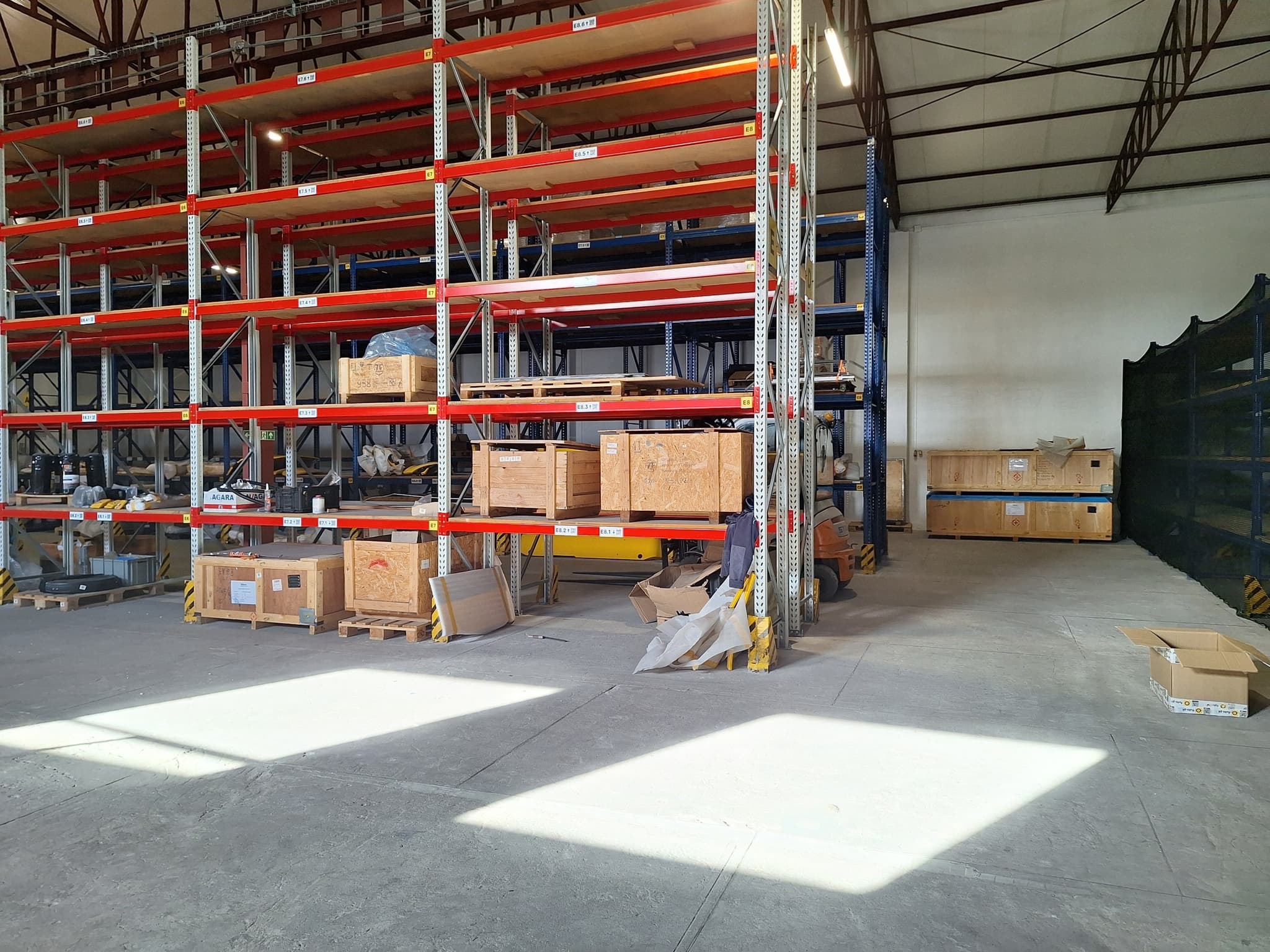 Corner section of the warehouse showing multiple racking rows and clear floor lanes