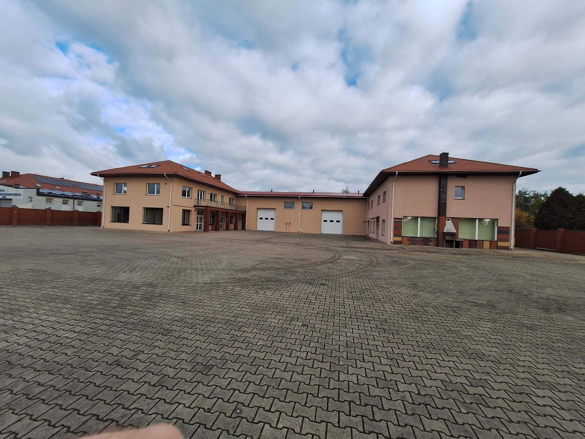 Xapika partner facility exterior — large-format warehouse serving European depot networks
